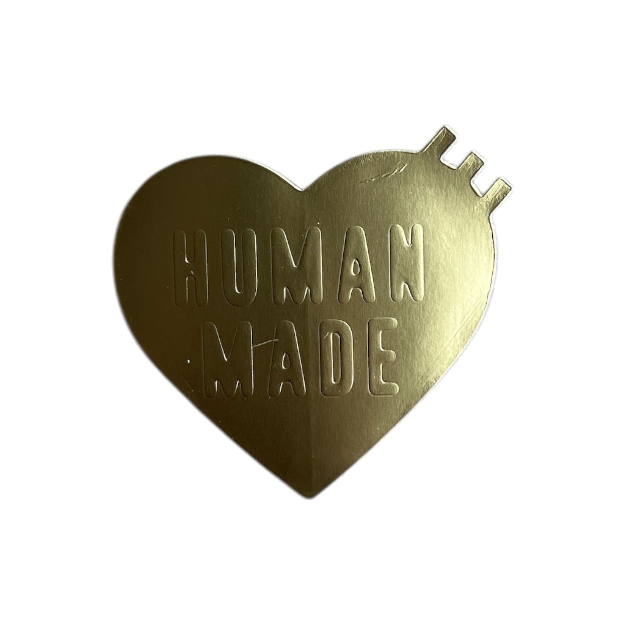 Human made heart shaped sticker in gold
