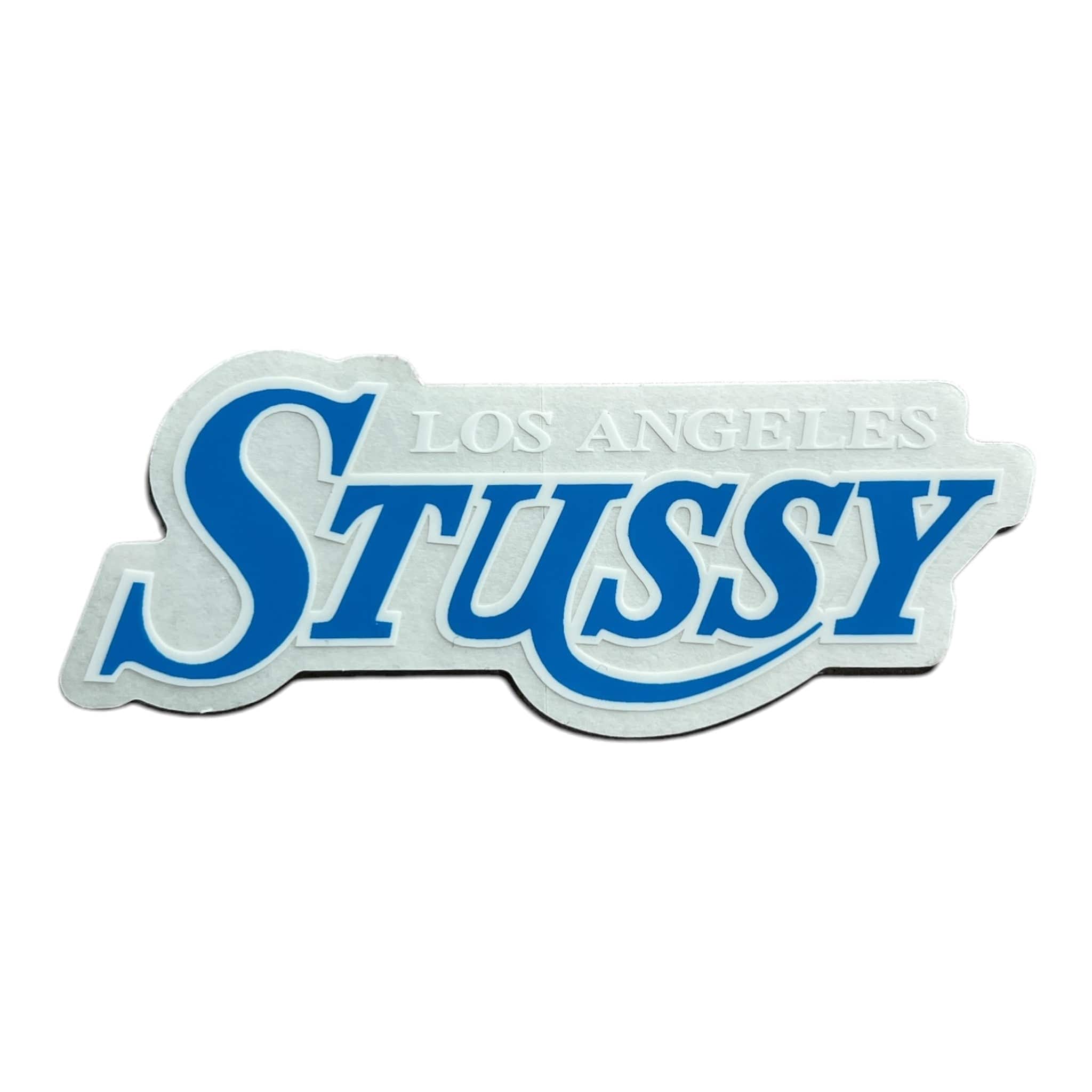 Stussy logo with 'Los Angeles' text on a white background